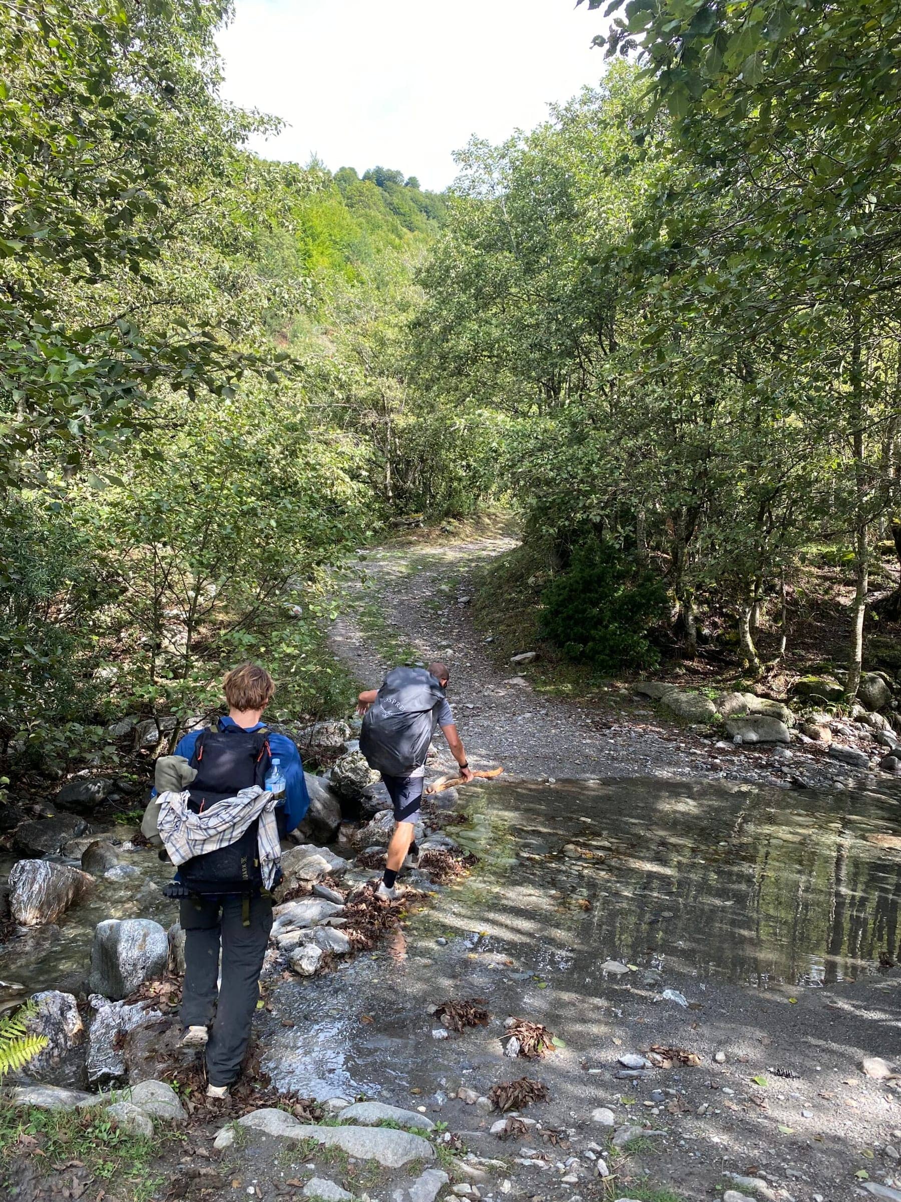 Brian and Gummy crossing a river in Cerem