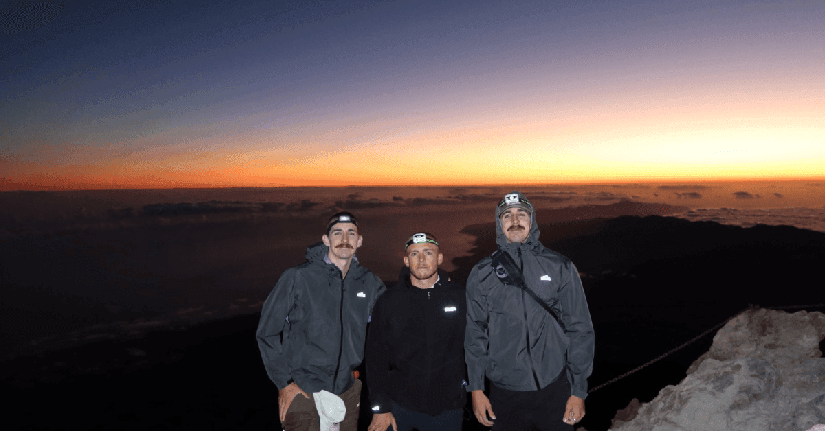 Riley Brazel, Jacob Ghanimeh and Jake Brazel standing on the summit of Mount Teide on Tenerife