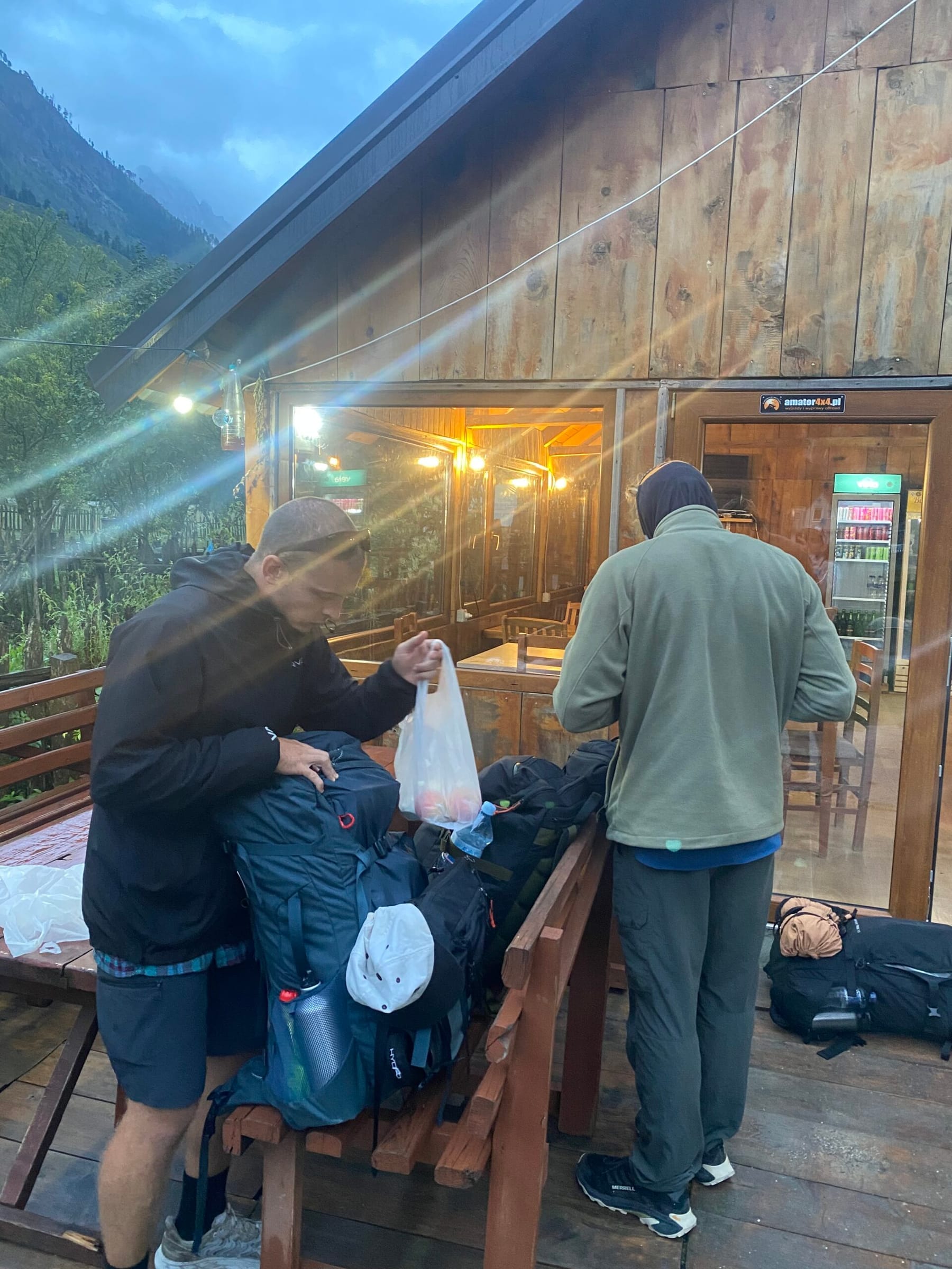 Gummy and Brian packing their lunches for the hike from Valbone to Doberdol