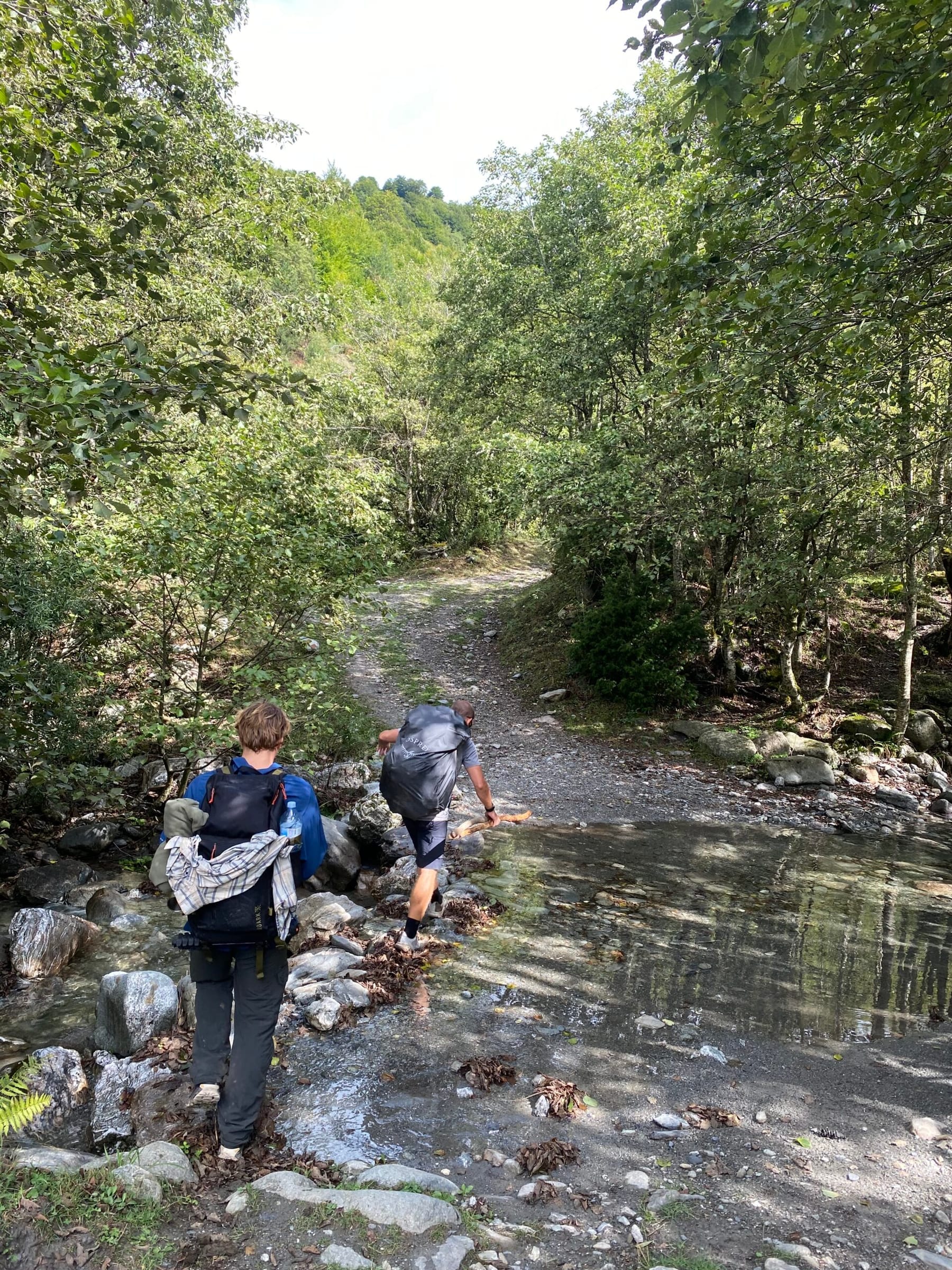 Brian and Gummy crossing a river in Cerem