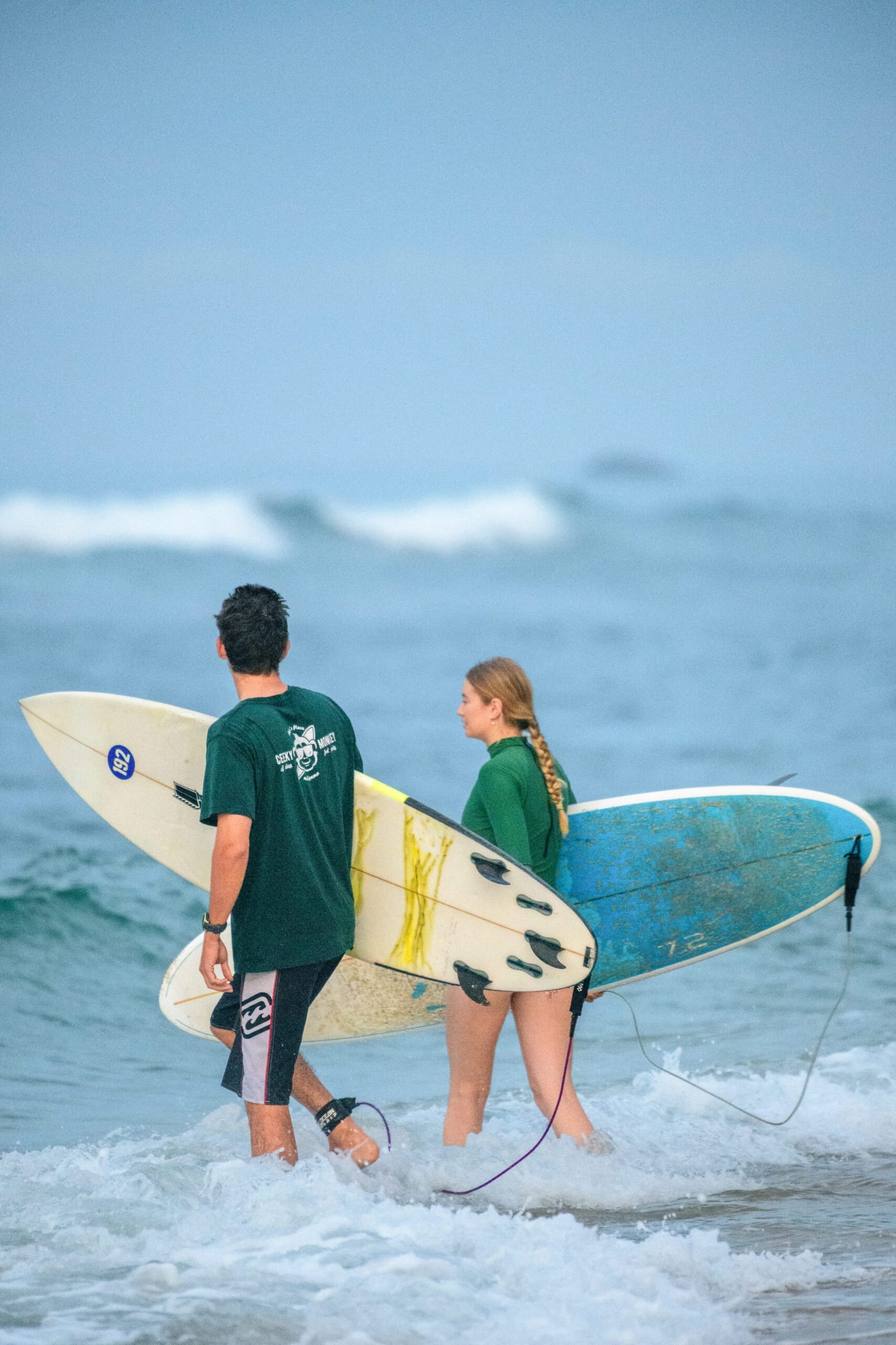 Riley and Belle walking out to the surf at Animals