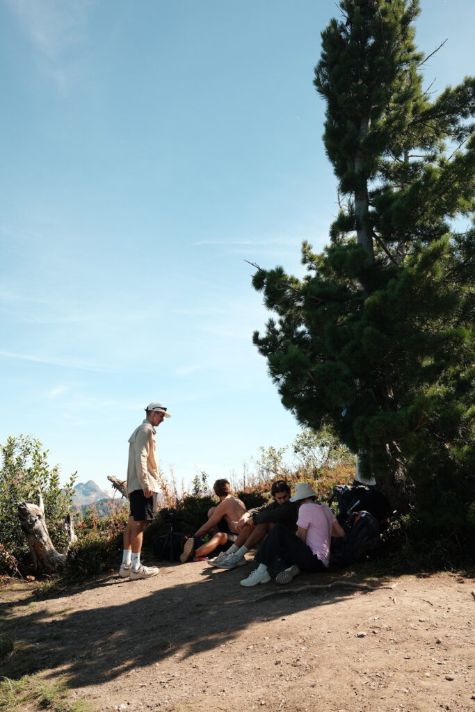 A group of hikers having lunch on a summit above Plav Lake