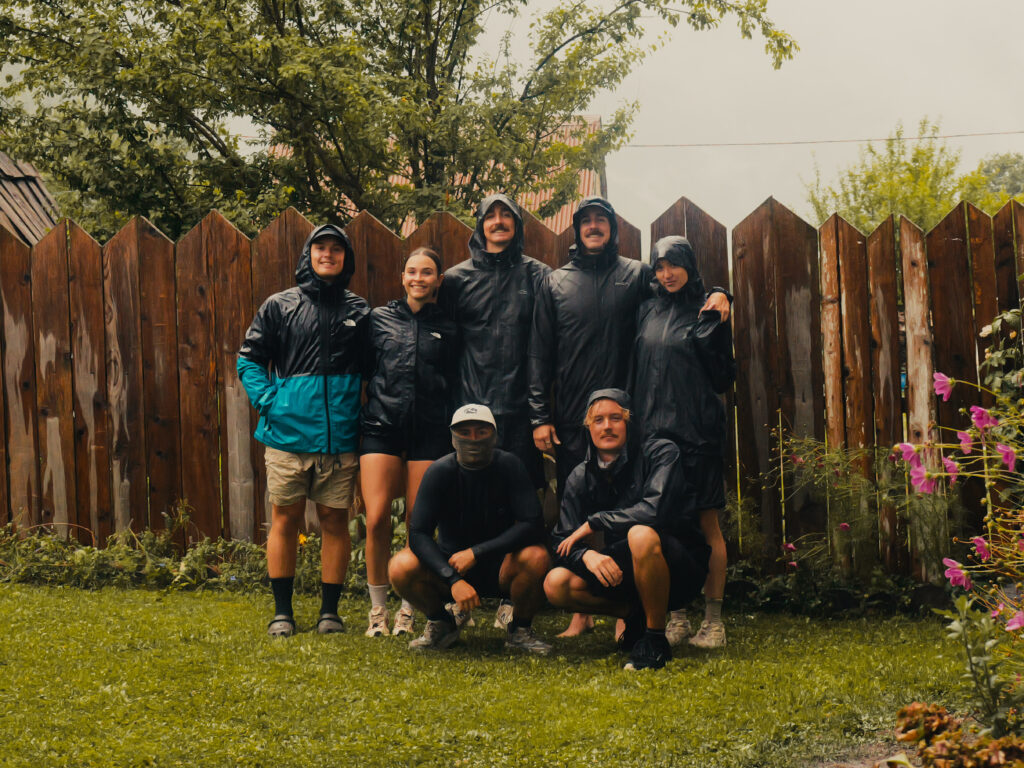 The group standing outside our accommodation in Valbone after surviving a thunderstorm on the trail