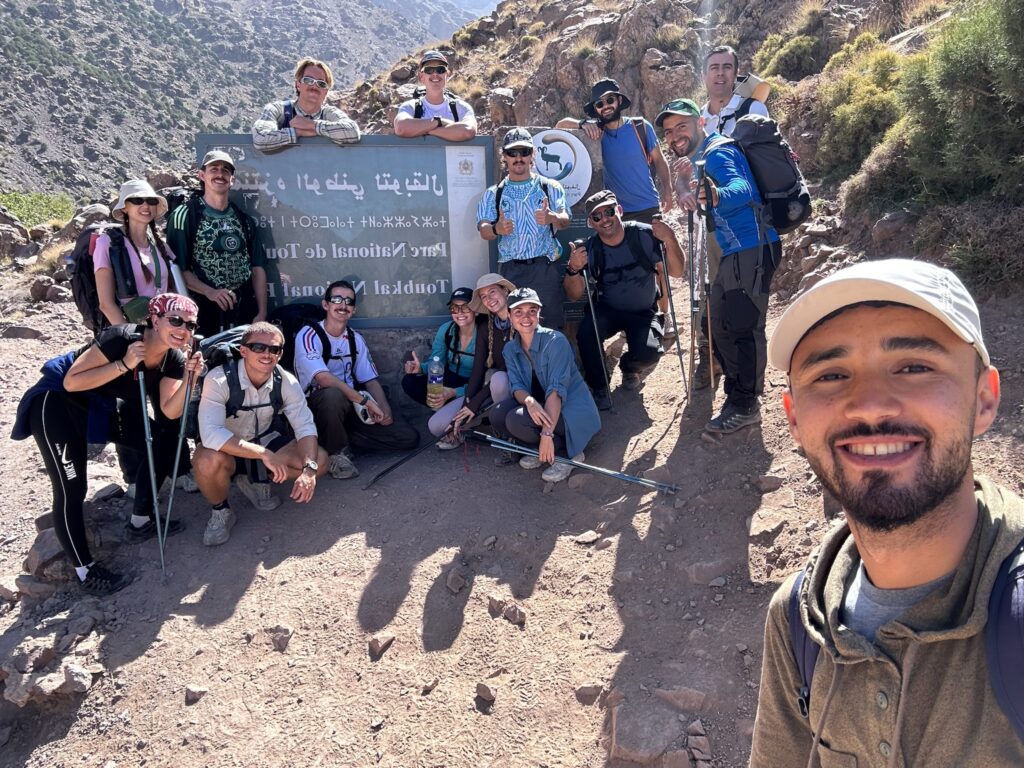 A tour group hiking in Morocco to Mount Toubkal